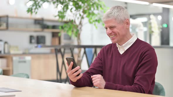 Middle Aged Man Doing Video Chat on Smartphone