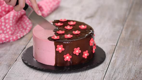 Cutting a Strawberry Mousse Cake with Mirror Glaze.