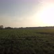 Aerial Cinematic Clip Drone Flying Over a Farm Field During Sunset - VideoHive Item for Sale