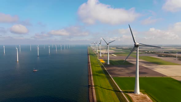 Offshore Windmill Park with Clouds and a Blue Sky Windmill Park in the Ocean Drone Aerial View with