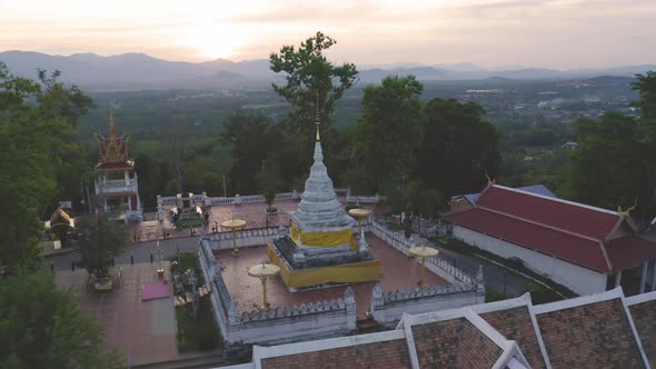 Aerial view of golden buddha pagoda stupa. Wat Phrathat Khao Noi Temple Park, Nan