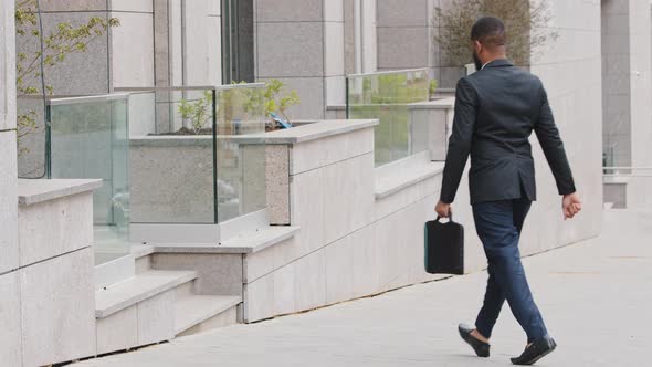 African American Young Man Wearing Suit Businessman or Manager Insurance Agent Walks Into Building