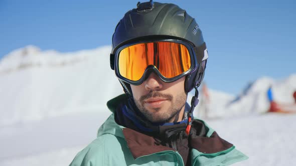 Happy Skier Portrait, Put Goggles in Sun on Slope