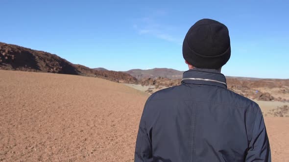 Man Looking Around Dry Arid Landscape