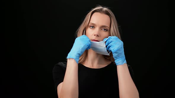 Portrait Feminine Posing Medical Gloves Putting on Face Mask