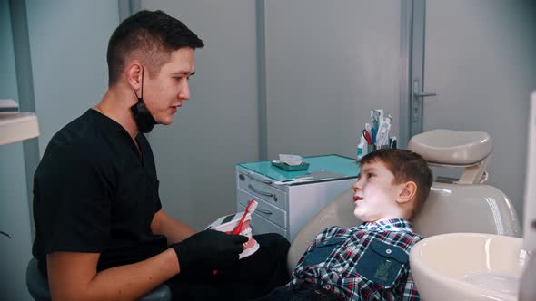 A Little Boy Having a Treatment in the Modern Dentistry - Talking About the Hygiene