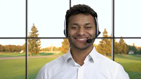 Male Call Center Agent on Windows Background.