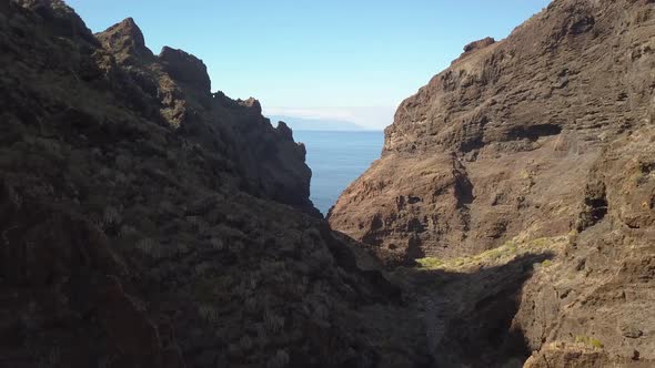 Flying through a Barranco near los Gigantes towards the island La Gomera.