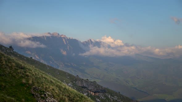 Summer Video Landscape Low Cloud Cover Flows Around Epic Cliffs on a Summer Evening at Sunset