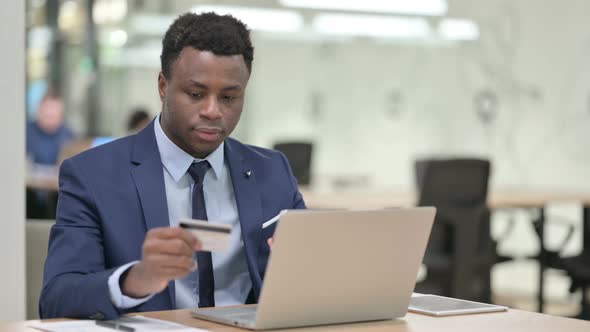Successful Online Shopping on Laptop By African Businessman