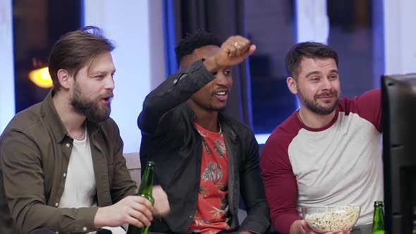 Fans of Football Encouraging their Favourite Team with Shouts at Home Near TV