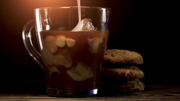 Pouring Milk into of Cold Brew Coffee 