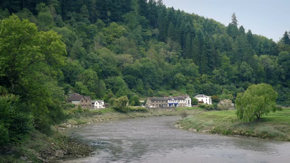 Pretty Rural Scene With Houses By The River