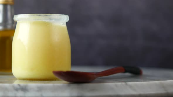 Homemade Ghee in Container on a Table 