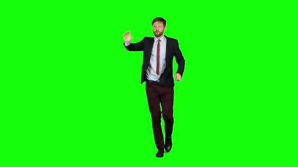 Guy Runs Around Waving To Others Who Meet Him on the Way. Green Screen