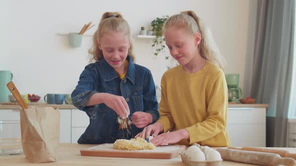 Little Sisters Cooking in Kitchen