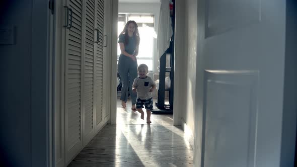 Little Baby Playing Catchup with His Mom in the Apartment