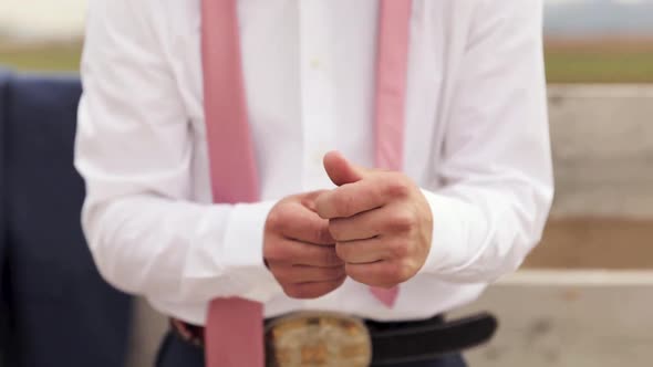 Young Male Cowboy Groom Adjusts White Shirt Sleeves While Getting Dress for Event 1080p 60fps