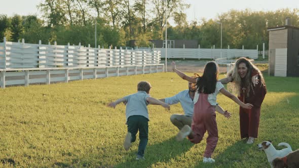 Kids Running and Hugging Parents