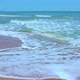 Sea Wave with Foam Runs on a Sandy Beach on a Sunny Summer Day - VideoHive Item for Sale