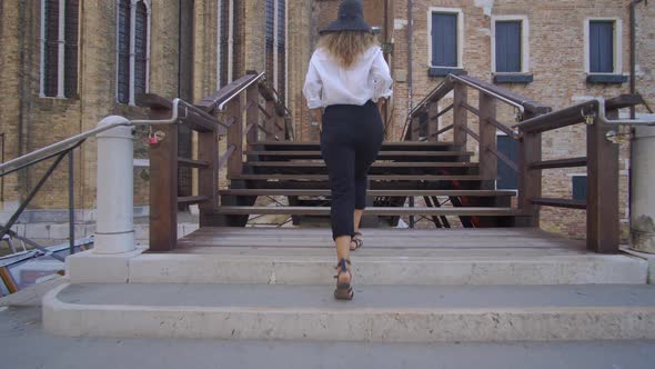 Girl Walking in Venice, Italy, Seeing Over Antique and Beautiful City