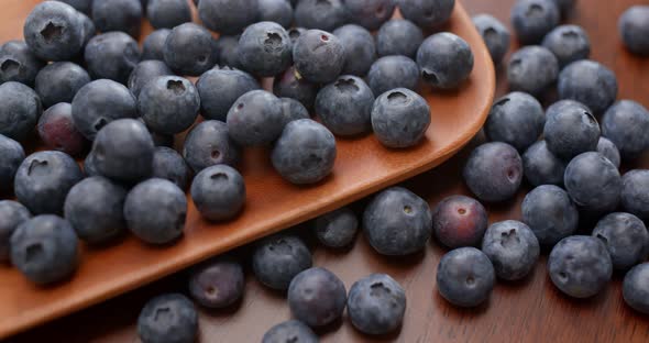 Stack of blueberry on the wooden plate