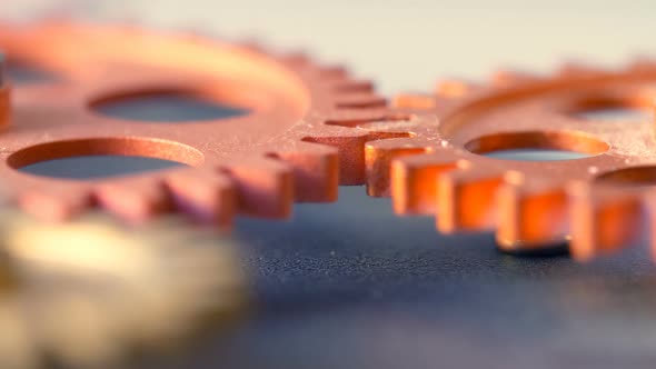 close up on clock 's mechanism: wheels spinning together