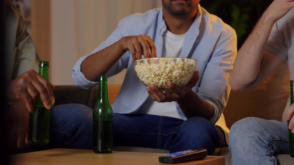 Happy Male Friends with Beer Watching Tv at Home