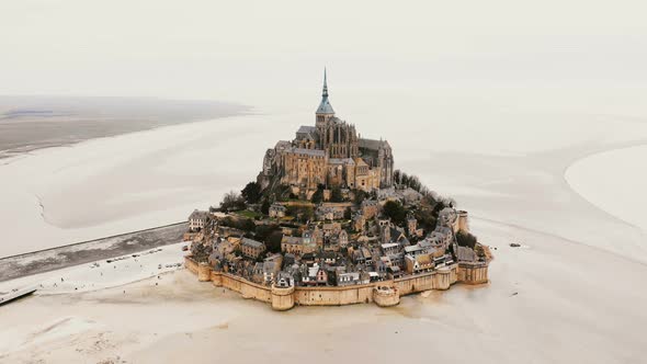 Drone Zooming in on Mont Saint Michel Abbey, Epic Island Fortress Town and Famous Travel Landmark in