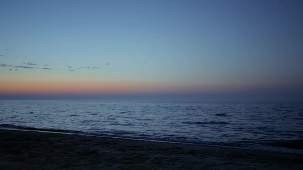 Beautiful View Beach Washed Sea Waves at Evening