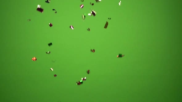 Green-screen scene with fallen celebration confetti.