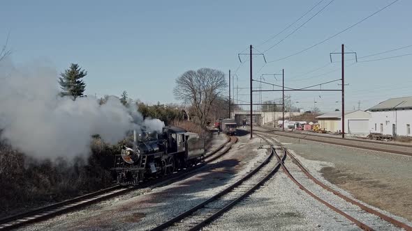 Aerial View of a Steam Locomotive Backing Up to Connect to a Passenger Train