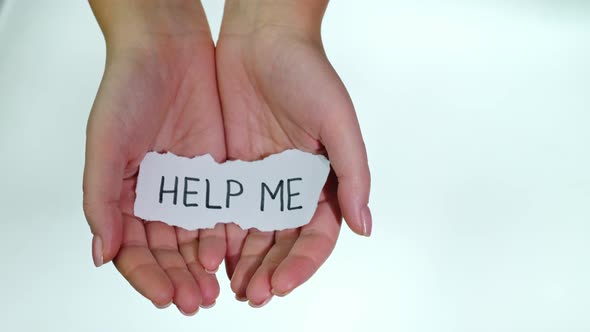 Hands with the Inscription HELP ME on a White Background