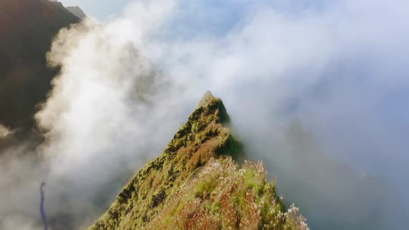 Cinematic Mountains Aerial Flying Through Clouds Above Rocky Green Peaks