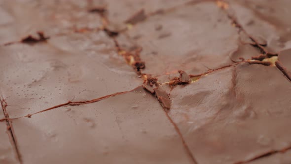 Shiny crackled chocolate cake glazed confectionary  surface slow panning 4K 2160p 30fps UltraHD vide