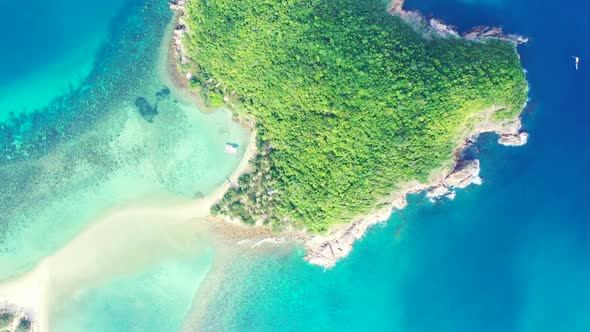 Aerial flying over landscape of perfect sea view beach wildlife by turquoise ocean with white sand b