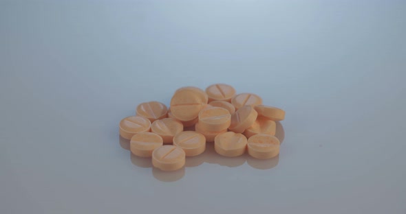 Prescription drugs - Capsules, pills, tablets on reflective background