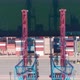 Drone Flying Over a Container Ship During Cargo Operations Over the Customs Area - VideoHive Item for Sale