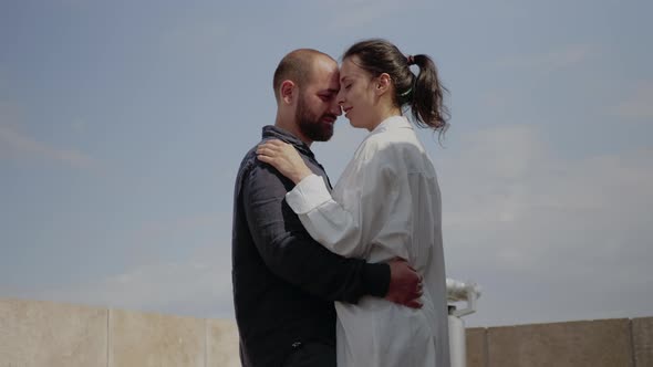 Caucasian Couple Enjoying Romantic Scene on Sky Tower