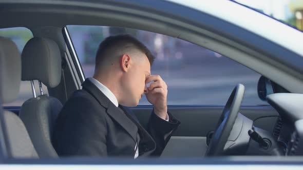 Exhausted Male in Formal Suit Sitting on Driver Seat, Stressful Life, Overwork