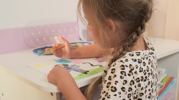 Talented Creative Child Girl Female Artist Draws with Her Hands on Paper Using Fingers Paints Brush