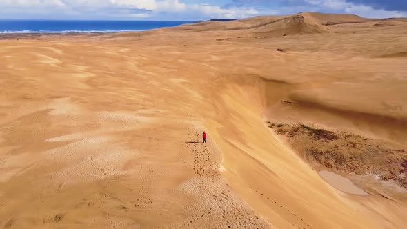 Walking on sand dunes in New Zealand