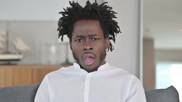 Portrait of Young African Man Feeling Shocked 