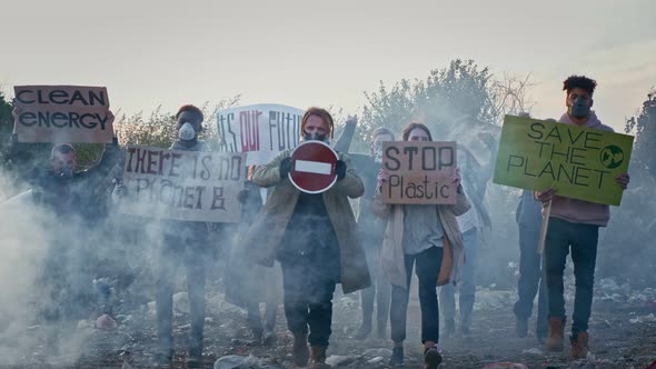 Young Man Activist Holding Stop Sign Going With Fighting People Protesting Against Garbage Pollution