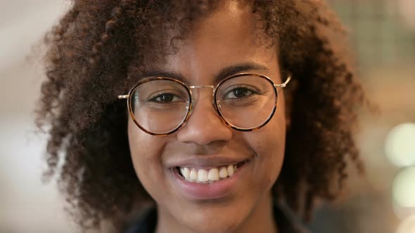 Close Up of Young African Woman Smiling at the Camera 