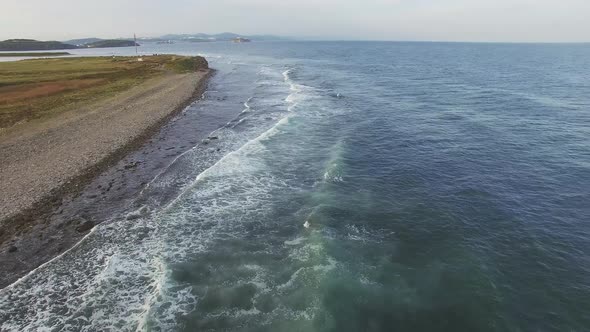 Drone View of the Sea Coast with Rocky Shore and Waves