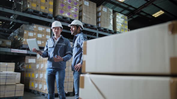 footage of engineer staff male warehouse worker in hard hat working