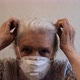 Slow Motion Portrait of Senior Woman Puts on a Protective Respirator. - VideoHive Item for Sale