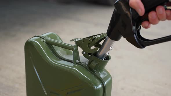 Filling Up a Jerrycan Fuel Container at a Petrol Station 09