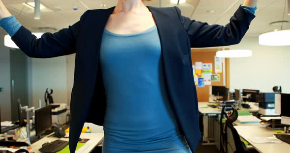 Businesswoman meditating in office